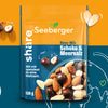 Verpackung des Nuss-Mixes Schoko Meersalz mit orangenem und blauen Hintergrund und Weltkugel auf der Nepal mit Herz markiert ist